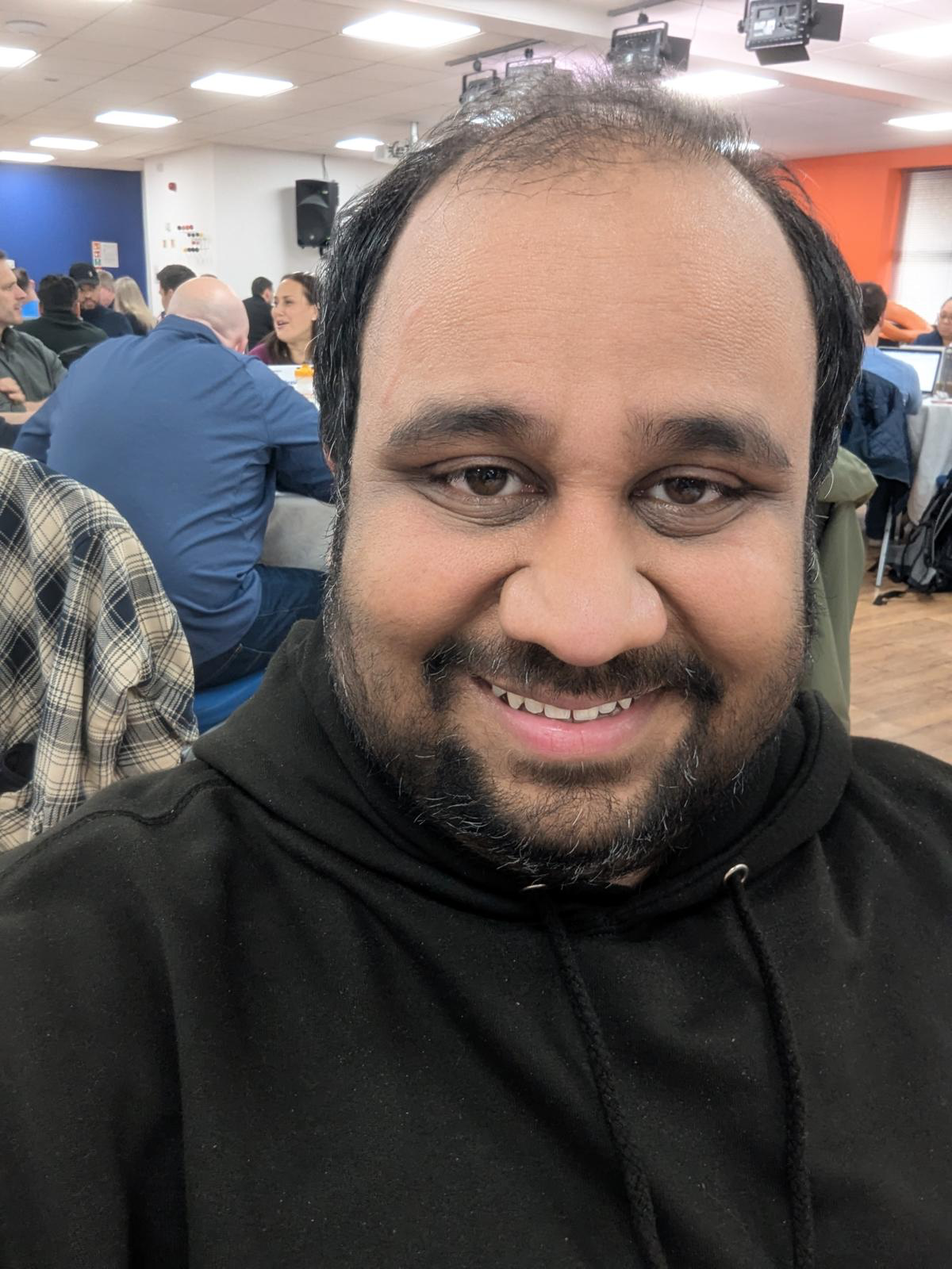 Portrait of Kartikeya Roy smiling at a property networking event